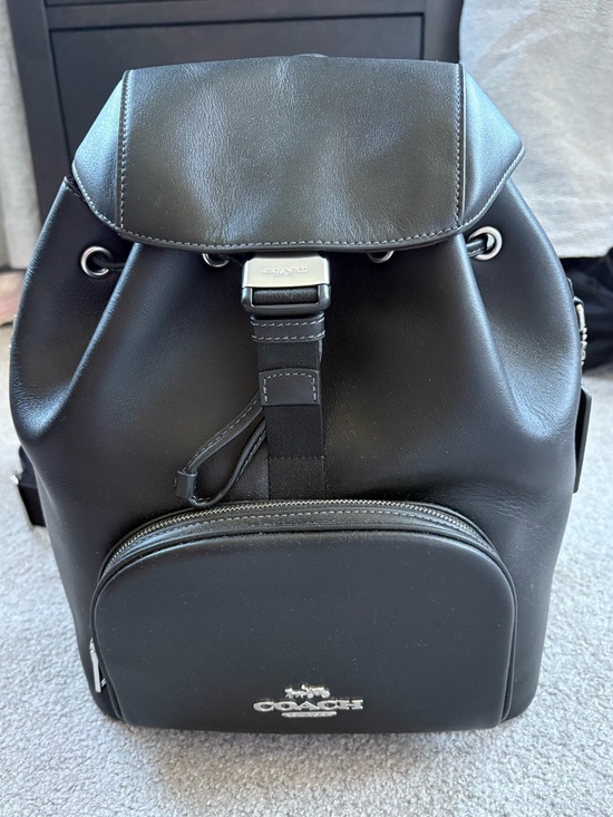 Coach Handbags - Coach Black Leather Backpack - New, but has "X" through leather creed.
